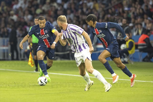 Football match, captain Kylian MBAPPE' Paris St. Germain left on the ball, a player of FC Toulouse