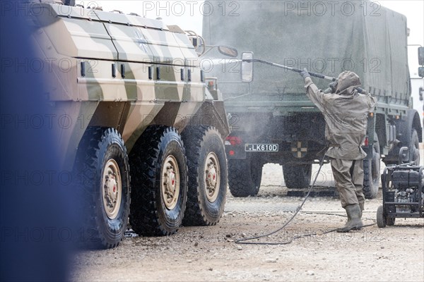 German soldiers of an NBC defence unit in protective clothing practice decontamination of an