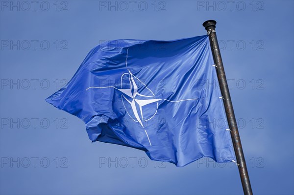 The NATO flag flies on the roof of Palais Czernin during the NATO meeting of foreign ministers