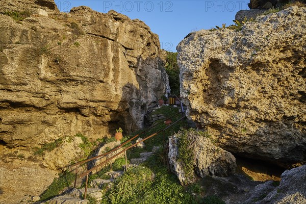 Rock chapel, Archangel Michael Panormitits, A stony footpath leads through a rocky landscape in