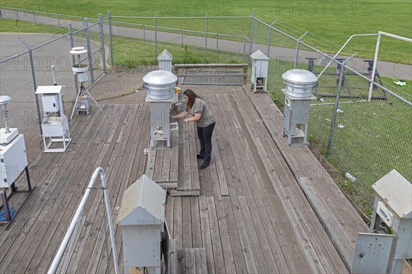 Dearborn, Michigan, Rebecca Robak, an environmental technician, checks air quality instruments at a