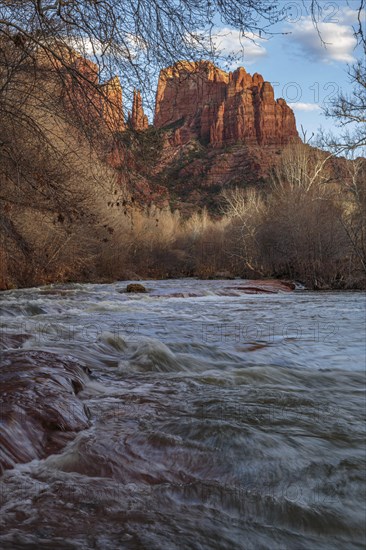 Cathedral Rock sandstone formations tower over Oak Creek at the Crescent Moon Picnic Site in