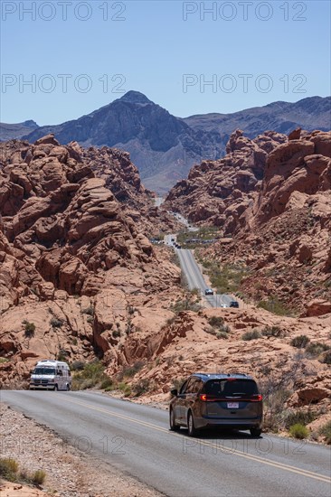 Traffic on Mouse's Tank Road winds between the red sandstone rock formations in Valley of Fire