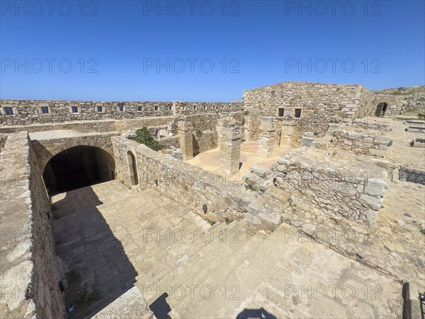 View of left access to former auxiliary gate casemates storage right basement wall remains columns