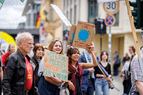 Demonstrators with signs at Fridays for Future, taken during the climate strike for the EU