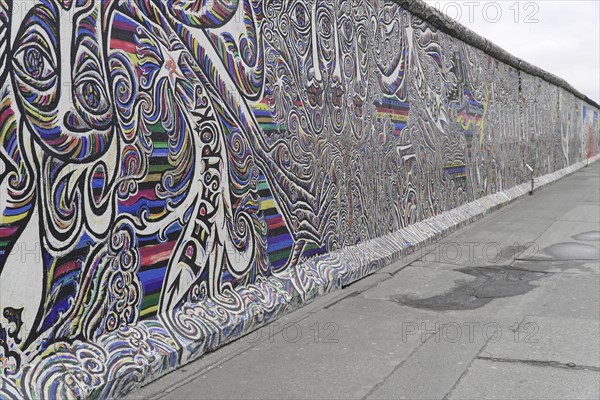 Graffiti on the Berlin Wall in the East Side Gallery, Berlin, Germany, Europe, Abstract, dynamic