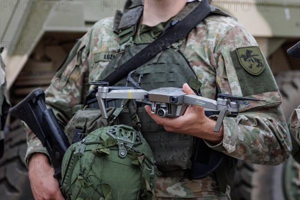 A Lithuanian army drone pilot holds a reconnaissance drone, taken during the NATO Steadfast