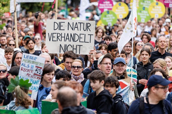 Demonstrators with signs at Fridays for Future, taken during the climate strike for the EU