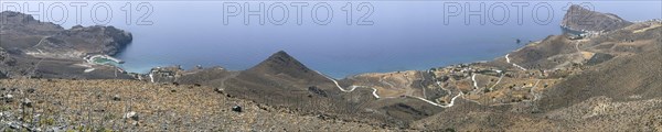 Panoramic view from elevated position on left Loutra with new small harbour on right small village