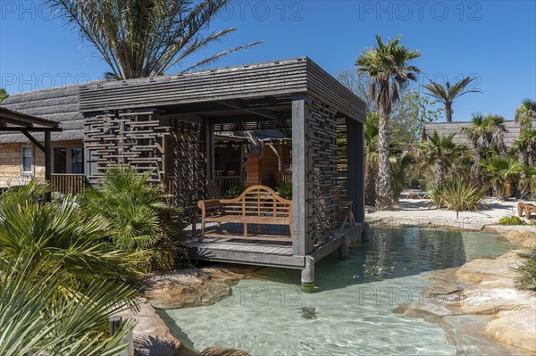 Modern wooden architecture in the holiday home development on the Plage de Port Grimaud beach, Port