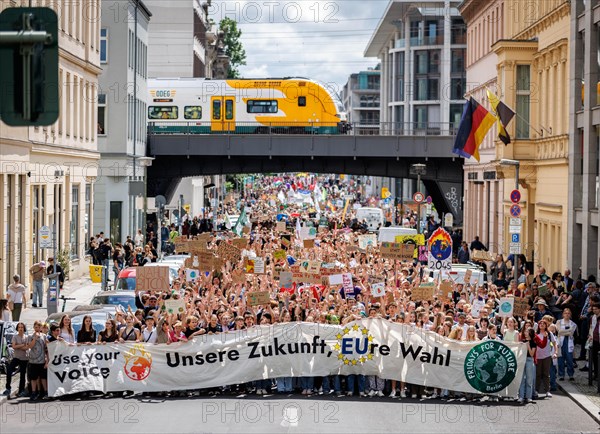 Demonstrators with signs at Fridays for Future, taken during the climate strike for the EU