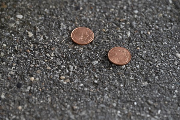 Money lying on the street, two five cent pieces, euro currency