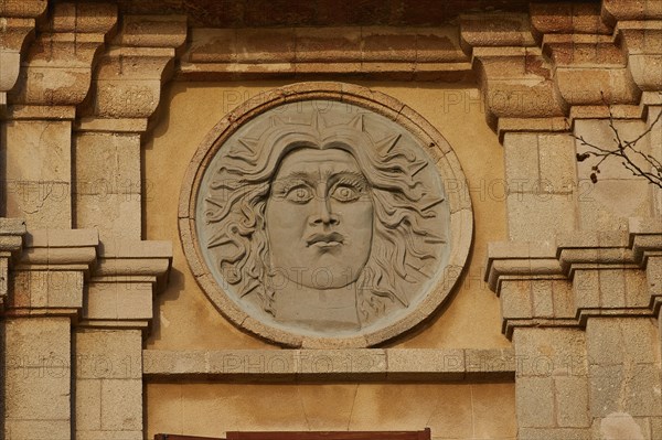 Sun god Helios, A relief of a sun face carved in stone on a historic building, Old Town of Rhodes,