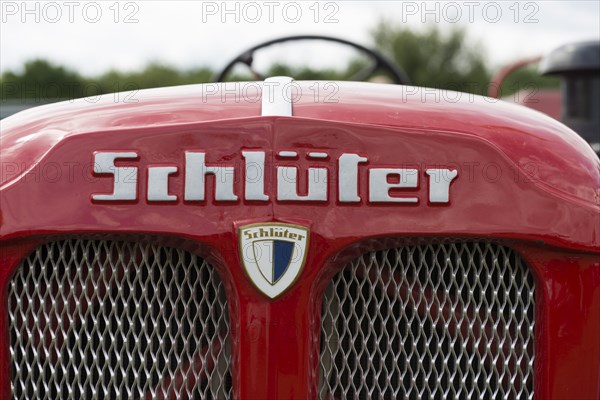 Schlueter tractor, lettering and company logo on red painted bonnet, Offenbach, Dreieich, Hesse,