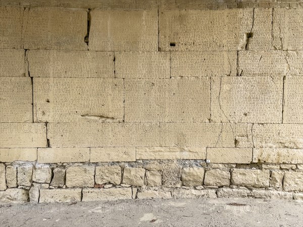 View of sandstone blocks Stones made of sandstone with written chiselled laws carved into the wall