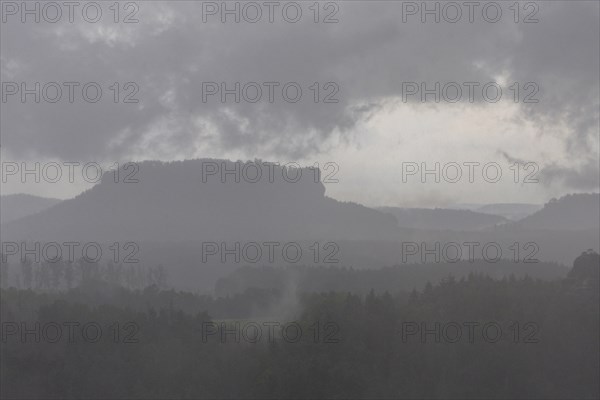 View from the goat's back in Saxon Switzerland during a thunderstorm, cloudburst, Hohnstein,
