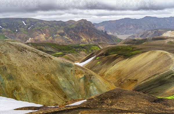Colourful volcanic landscape with hills and snow, Laugavegur trekking trail, Landmannalaugar,