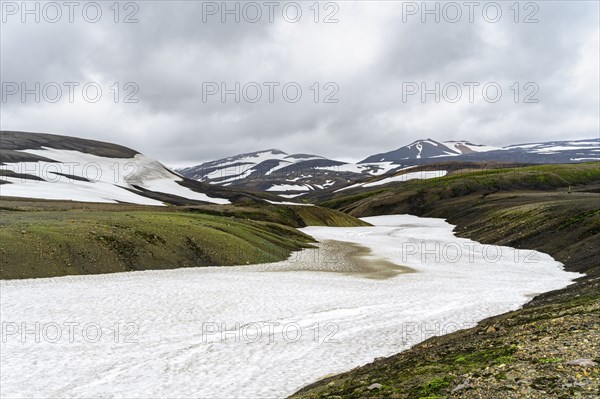 Colourful volcanic landscape with hills and snow, Laugavegur trekking trail, Landmannalaugar,