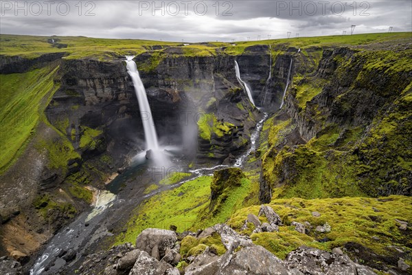 River and waterfalls at a canyon with green moss, Haifoss and Granni waterfall at a canyon, Fossá í