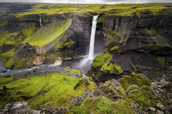 River and waterfalls at a canyon with green moss, Haifoss and Granni waterfall at a canyon, Fossá í