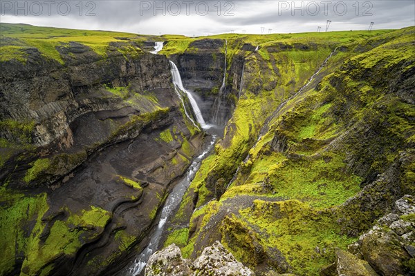 River and waterfalls at a canyon with green moss, Haifoss and Granni waterfall at a canyon, Fossá í