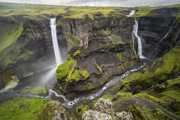 River and waterfalls at a canyon with green moss, Haifoss and Granni waterfall at a canyon, Fossá í