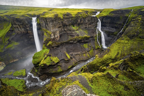 River and waterfalls at a canyon with green moss, Haifoss and Granni waterfall at a canyon, Fossá í