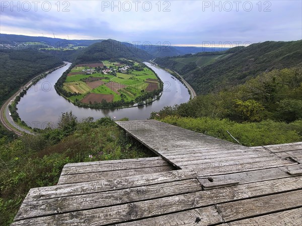 River loop of the Saar. The river winds through the valley and is surrounded by green hills and