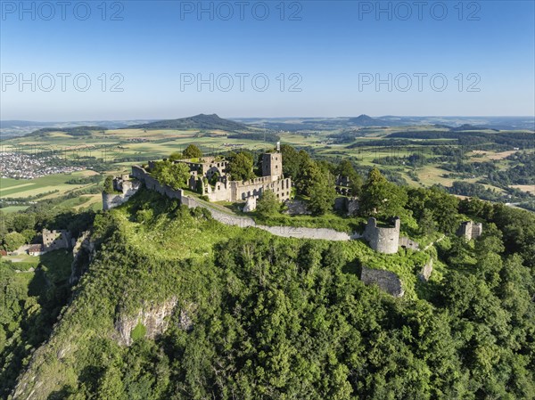 Aerial view of the volcanic cone Hohentwiel with Germany's largest fortress ruins, on the horizon