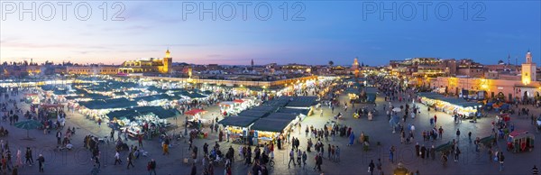 Marrakech, Morocco, March 27, 2018: Panoramic high angle dusk view over Jemaa El-Fna square at