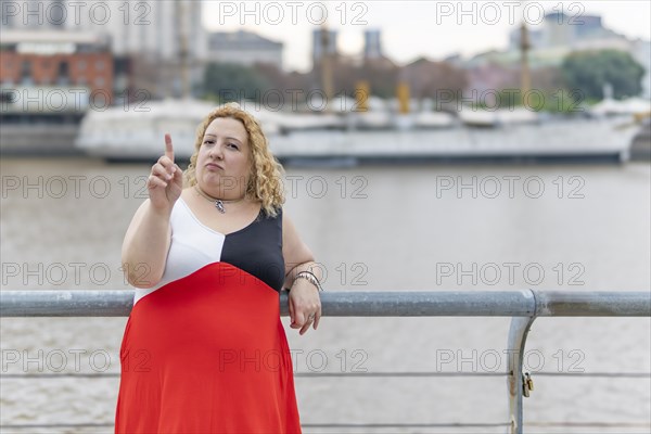 Plus size woman saying no with her hand. Stop concept. Rejection concept. Non-approval concept