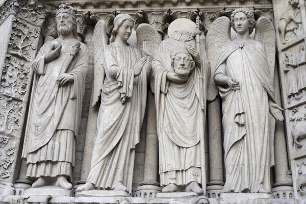 Figures of saints, Detail of the Gothic entrance portal of Notre Dame de Paris Cathedral, Paris,