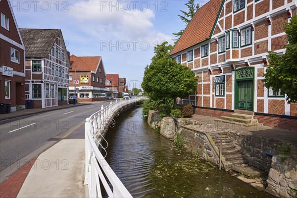 Street and stairs from the ditch Jorker Hauptwettern to the town hall in Jork, Altes Land, district