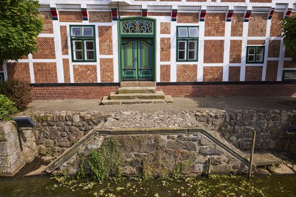 Stairs from the Jorker Hauptwettern moat to the town hall in Jork, Altes Land, Stade district,