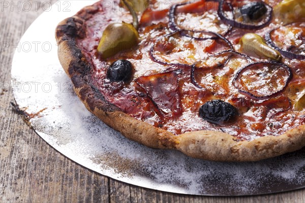 Pizza with ham and olives