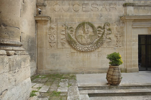 Relief and monument to Roman Emperor Julius Caesar with inscription, Hotel Jules César, Arles,