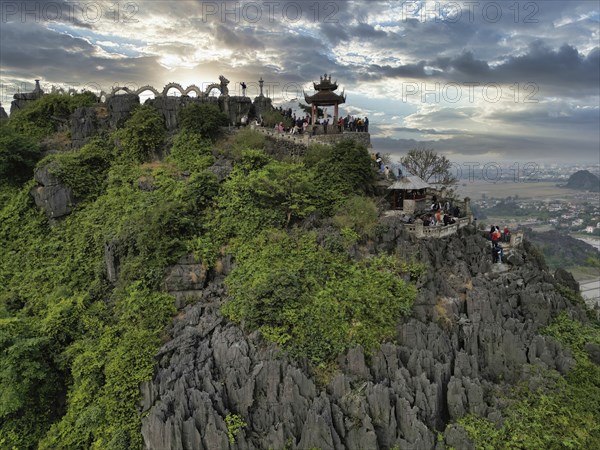 Top pagoda of Hang Mua temple with dragon in Tam Coc, Ninh Binh province