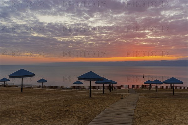 Sunset at Dead Sea at the beach of the Holiday Inn Hotel