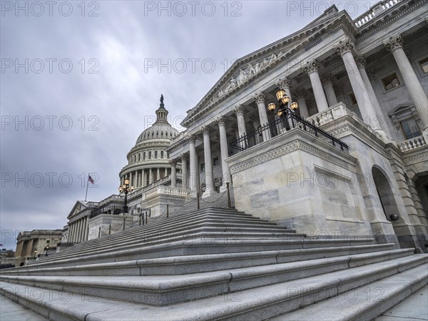 The United States capitol building with dark clouds above