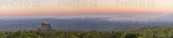 Taung Kalat Monastery seen from Mt. Popa Resort in Myanmar at dusk