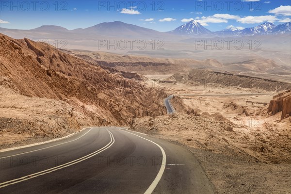 Road leading through the arid landscape at the Valley of the Moon in Chile