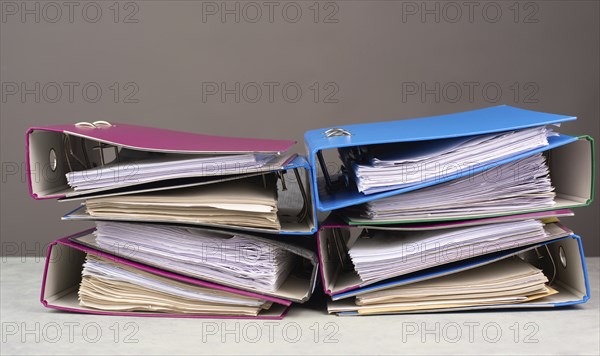 Pile of file folders, burnout, stress and overworked, pressure at work, deadline
