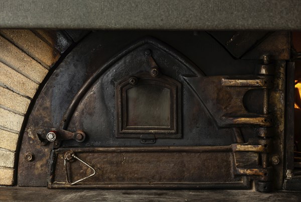 Antique wood oven with cast iron door