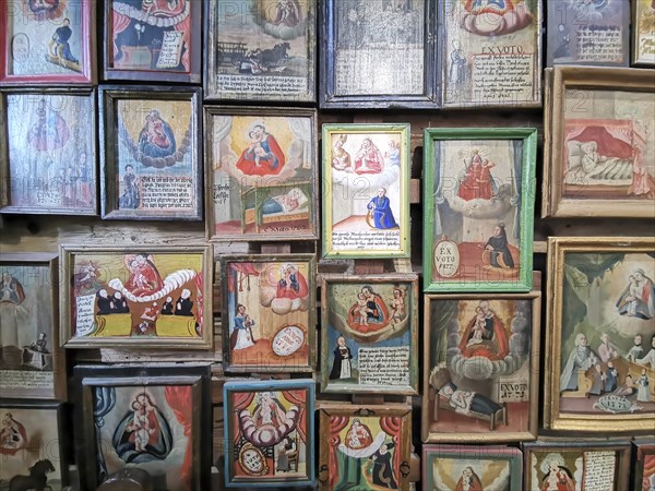 Votive pictures, votive tablets on the walls of the chapel of grace inside the church, pilgrimage