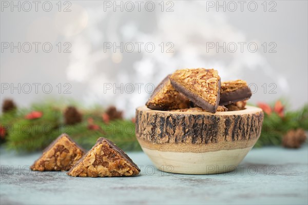 Nut corner triangles, traditional german sweets called Nussecke, covered with chocolate, christmas