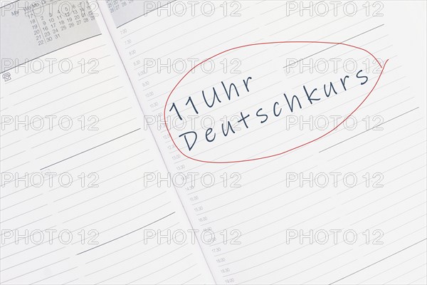 The words german course at 11 oÂ´clock are standing in the german language in the calendar,