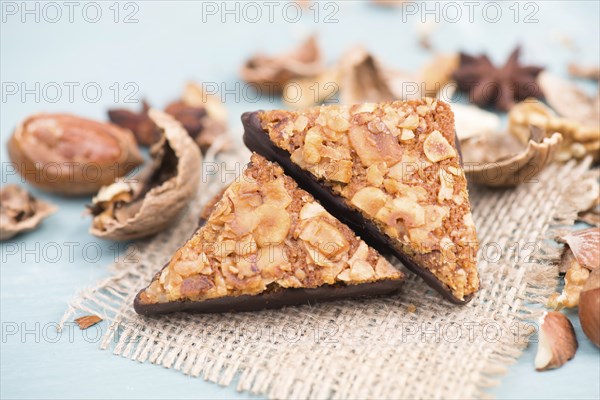 Nut corner, traditional german sweets called Nussecke, covered with chocolate, christmas baking