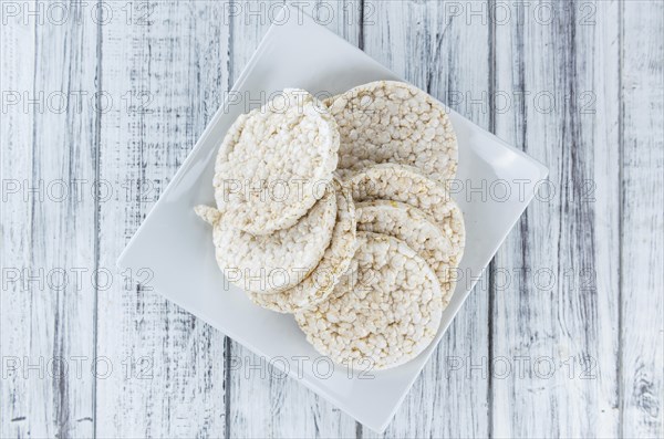 Old wooden table with Rice Cakes (detailed close-up shot)