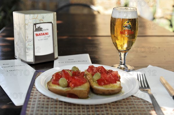 Bruschetta in Pienza, Crete Senesi, Tuscany, Italy, Europe, Fresh tapas served with beer on an