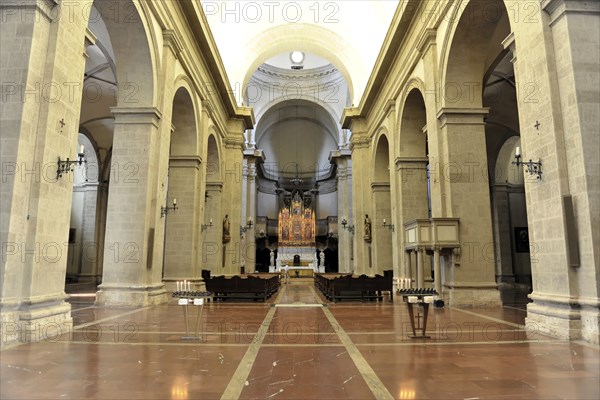Montepulciano, Tuscany, Italy, Europe, A wide church interior with marble floor, large columns and